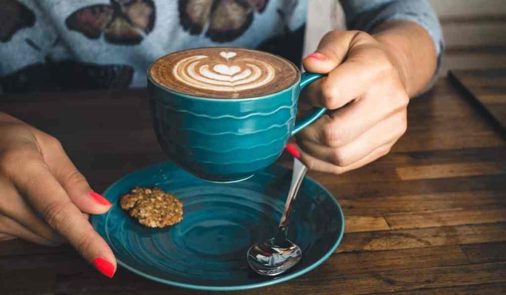 Woman drinking a cup of Colombian coffee