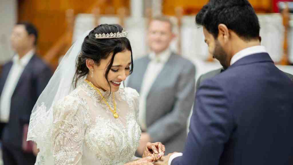 Wedding ceremony, with guests dressed in colorful costumes.