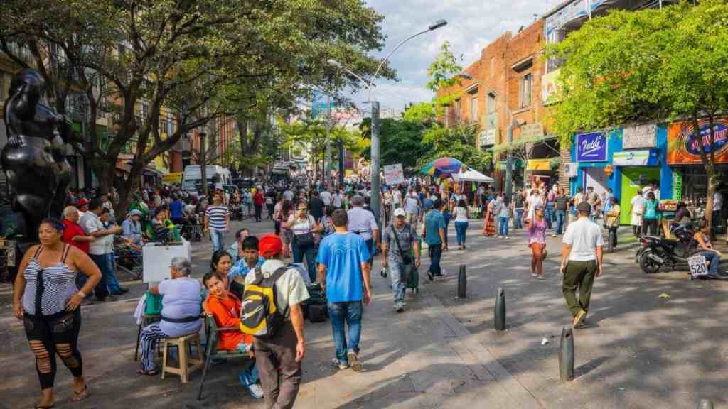 Tourists walking through the streets of Medellín